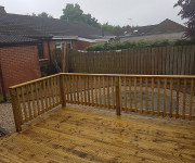 Roe Landscapes Paving & Landscaping Specialists, Dungiven, Decking with circle paving and stones and fence