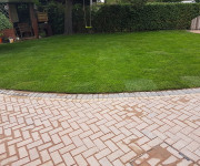 Roe Landscapes Paving & Landscaping Specialists, Dungiven, brick paving in back garden with hedge